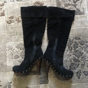 Suede knee high boots.